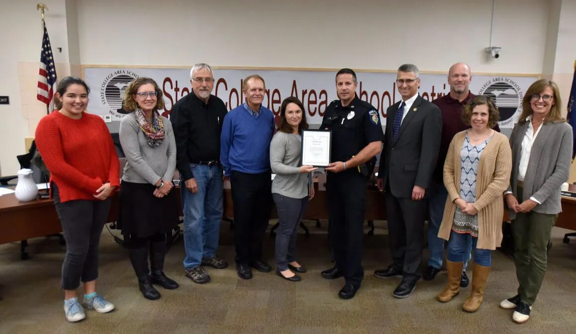 Amber Concepcion with fellow board members receiving a community recognition